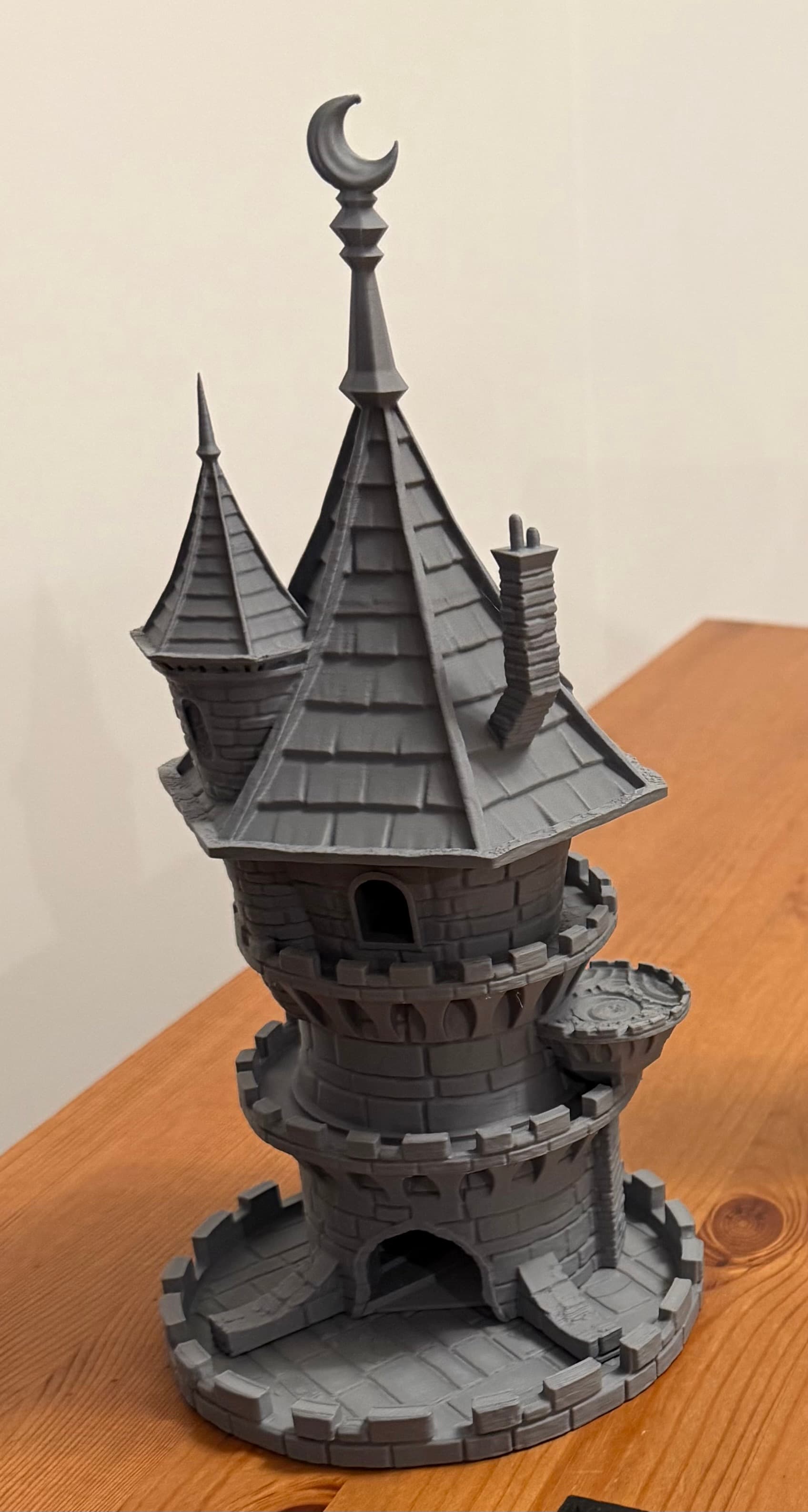 Wizard Dice Tower — castle with crescent moon spire and turrets